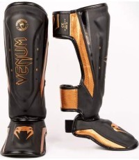 Venum Elite Evo Shinguards - melni/bronzas krāsas