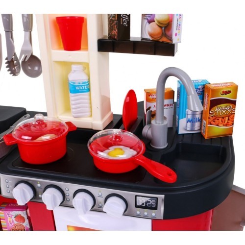 Kitchen with fridge, water tap