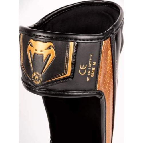 Venum Elite Evo apakšstilbu sargi, melni/bronzas