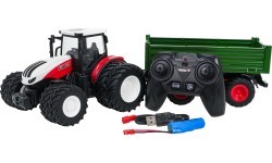 Sarkans tālvadības traktors ar zaļu puspiekabi